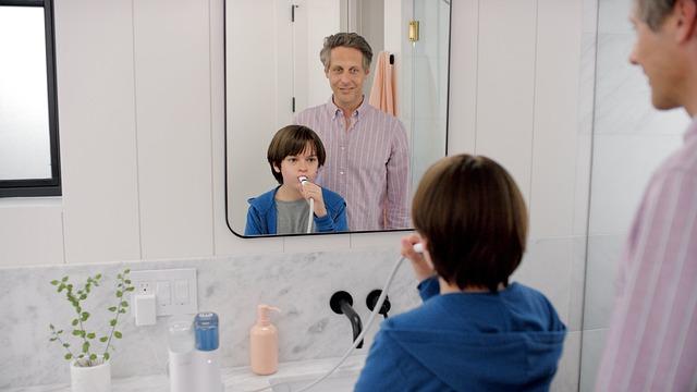 An adult nearby while a child practises an everyday routine